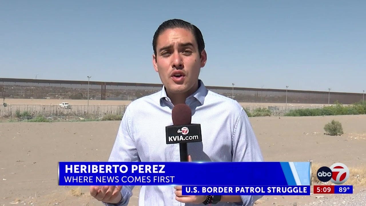 Video shows people climbing border wall - YouTube