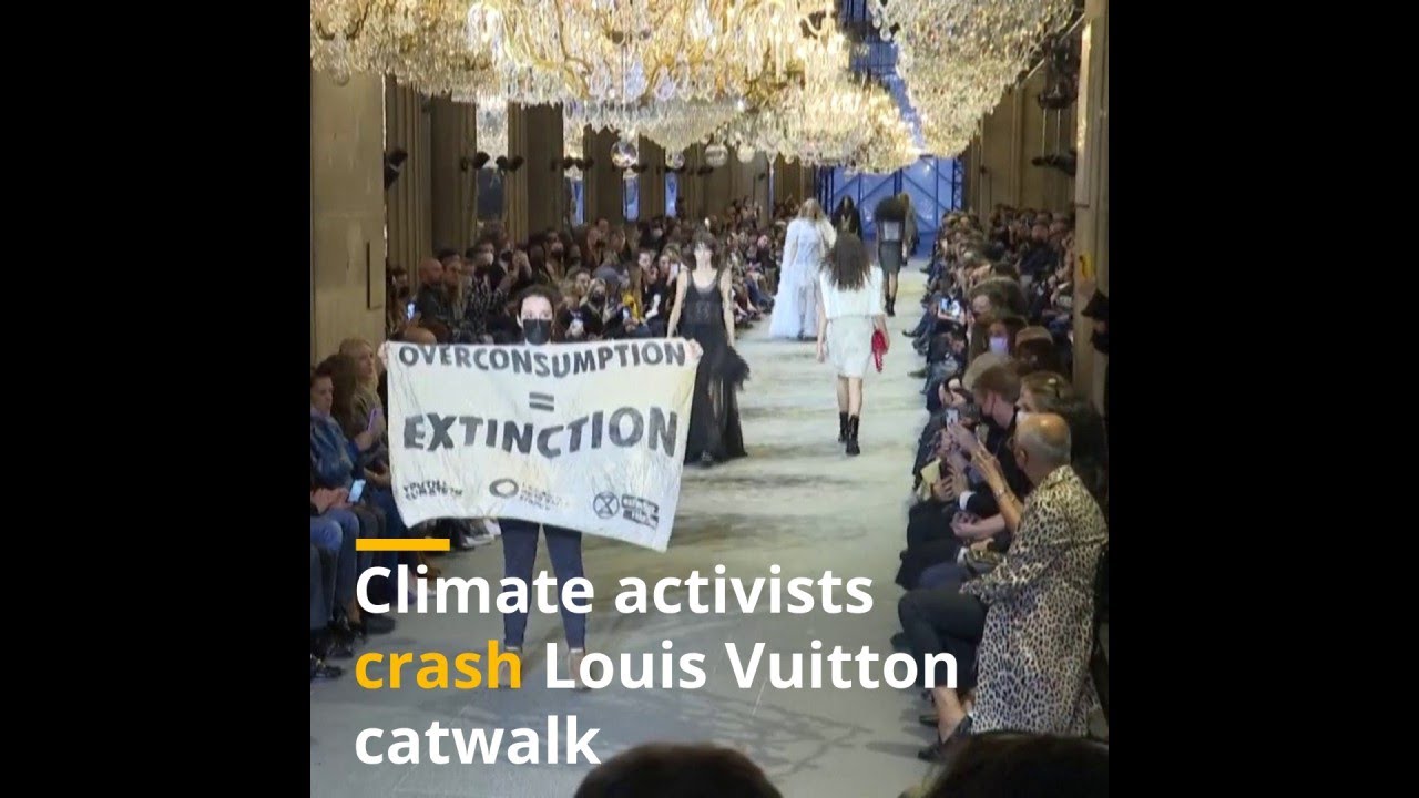 Climate activists storm Louis Vuitton catwalk