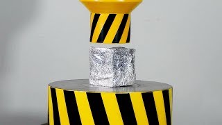 A HYDRAULIC PRESS PRESSES THE FOIL TO A UNIFORM ALUMINUM STATE