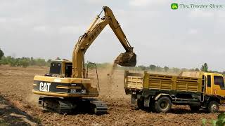 Excavator Caterpillar 312B Working Digging Soil Loading Dump Trucks