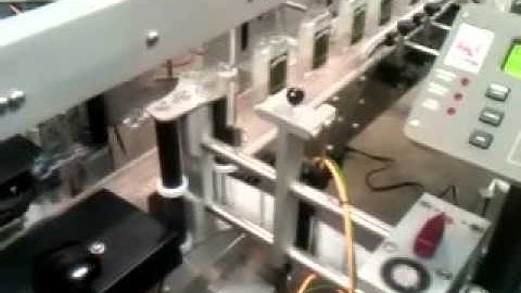 Quadrel Labeling | Labeling System for Glass Bottles | Front / Back Application