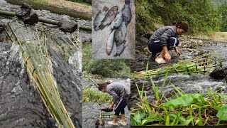 Girl makes a simple bamboo fish trap in prehistoric style