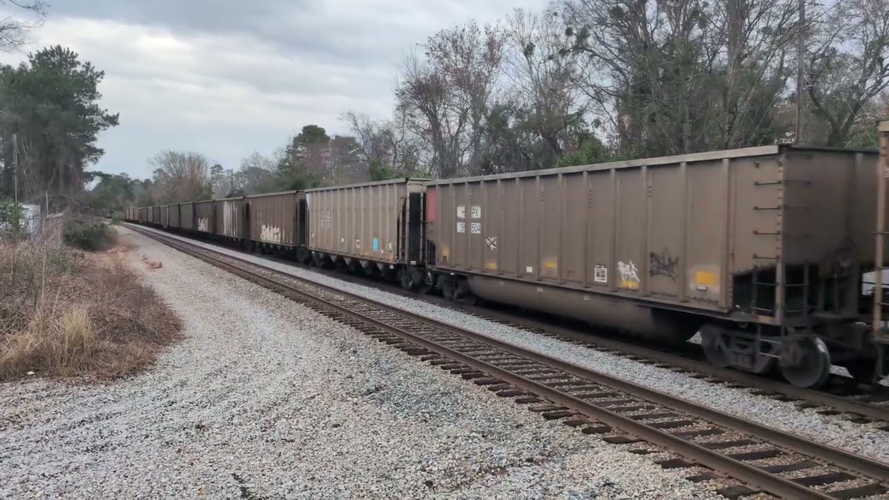 CSX 3072 and CSX 5208 lead a north bound empty coal train through downtown Hope Mills 2/21/2026