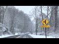 Relaxing Snowy drive after a snow storm in hilly area