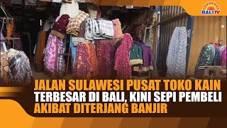 Jalan Sulawesi, the largest fabric store in Bali, is now deserted of shoppers due to flooding.