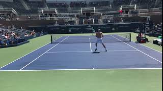 Isner Follows a Ferocious Kick Serve to Net