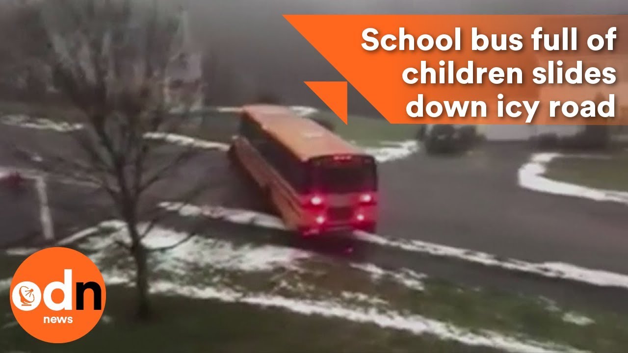 School bus full of children slides down icy road - YouTube