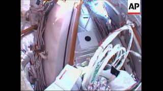 Astronauts restore power but spacewalk cut short