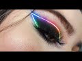 Smokey black eyeshadow + Neon rainbow eyeliner