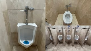 Shell men’s restroom with 2000s Eljer and Crane fixtures.