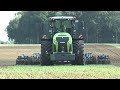 Claas Xerion 4000 with Köckerling Vector 8m cultivator coming close on German farm