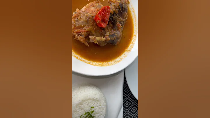 Ivorian dish of kedjenou and rice. In English this is guinea fowl