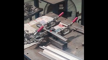 How are the cylindrical holding rods of the display stand welded on, after watching this video you w