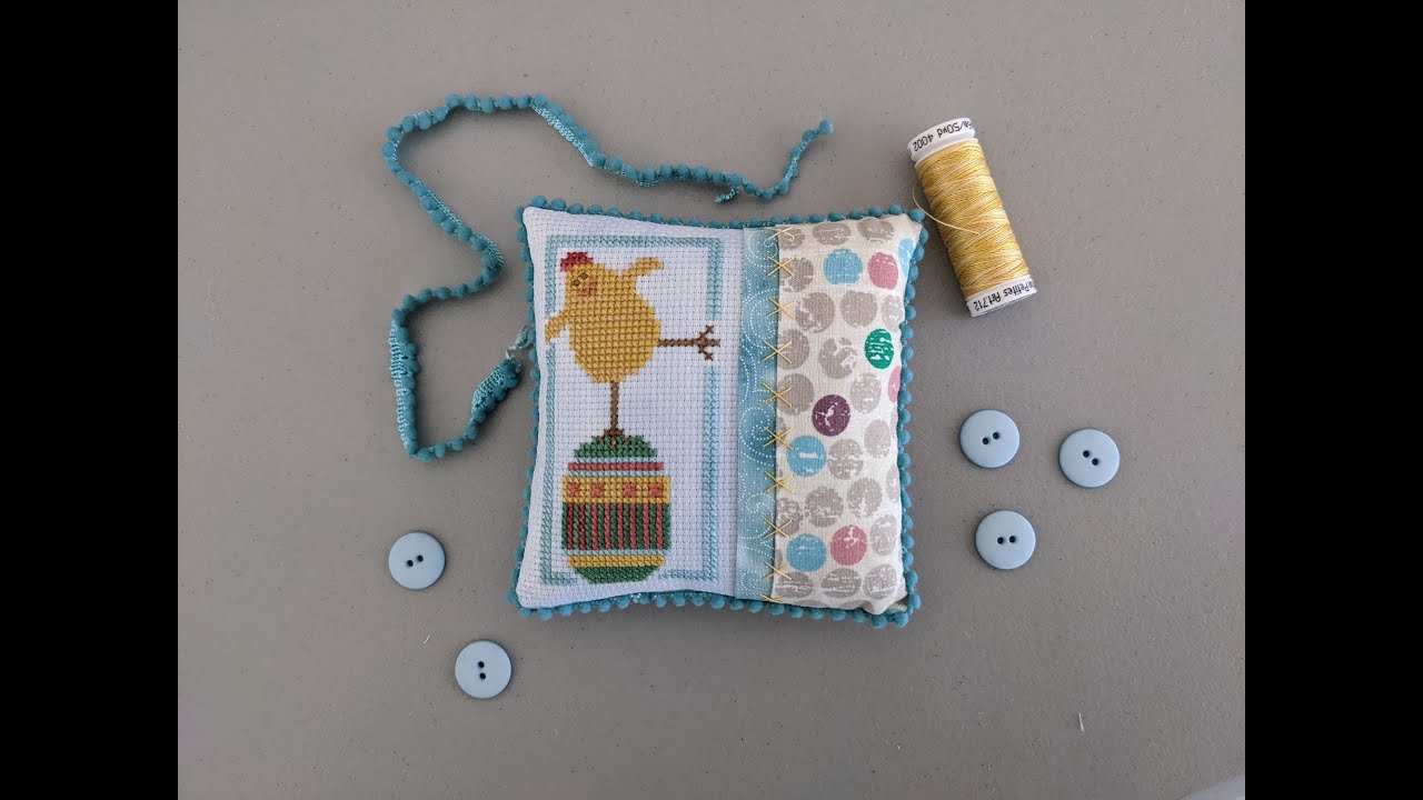 Flosstube Extra: Cross Stitch Embellished pillow with pom pom trim finishing tutorial