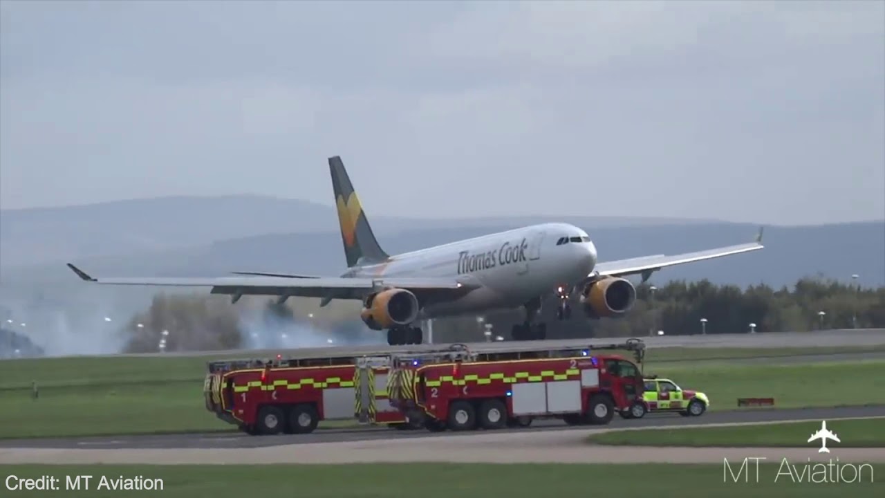 Thomas Cook A330 200 Emergency Landing at Manchester Airport  Gear Failure  Extremely Low Landing