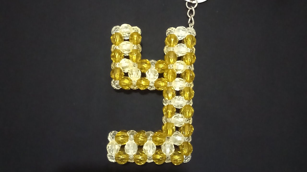 طريقه عمل ميدالية علي شكل حرف y  من الخرز