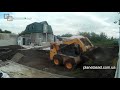 Планировка чернозема на участке с помощью BobCat