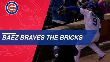 Baez tumbles into stands after terrific catch