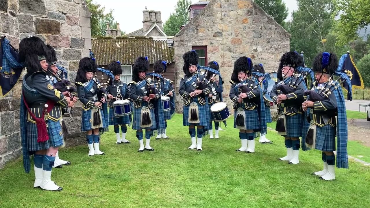 RAF Central Scotland Pipes and Drums playing outside St Margarets