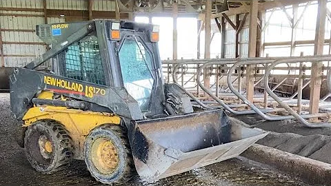 Cleaning and bedding barns with the skid steer