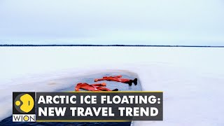 Arctic ice floating is Laplands latest trend | Tourists float on icy lakes to wind down & relax