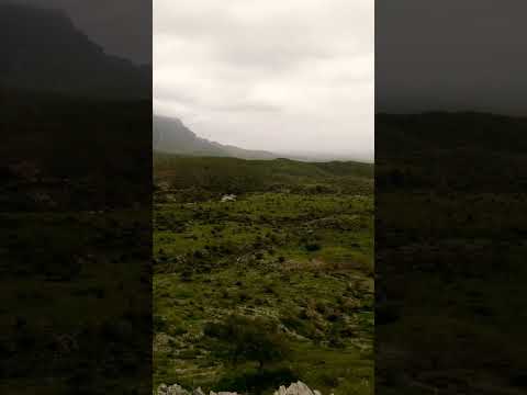 Clouds touching mountains