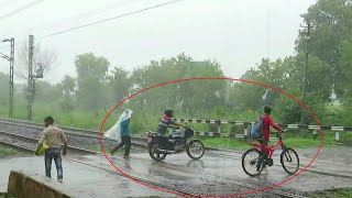 Very Risky Situation:Gate Closed For 1 Hour To Cross 4 Highspeed Trains In Heavy Rain