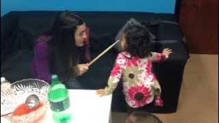 Mom Spanking her kid with a drum stick