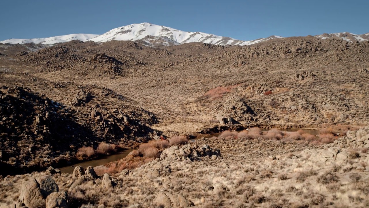 uhd aerial flying over rugged desert terrain in nevada