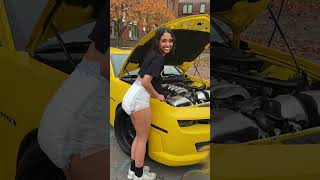 Woman Works On Engine Wearing A Diaper