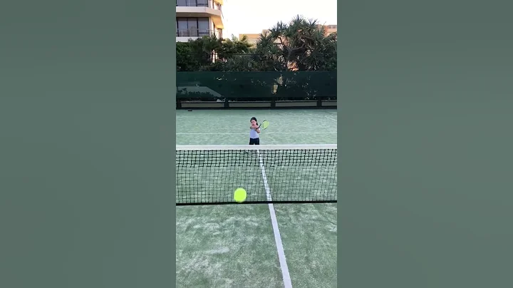 2 year old practising tennis