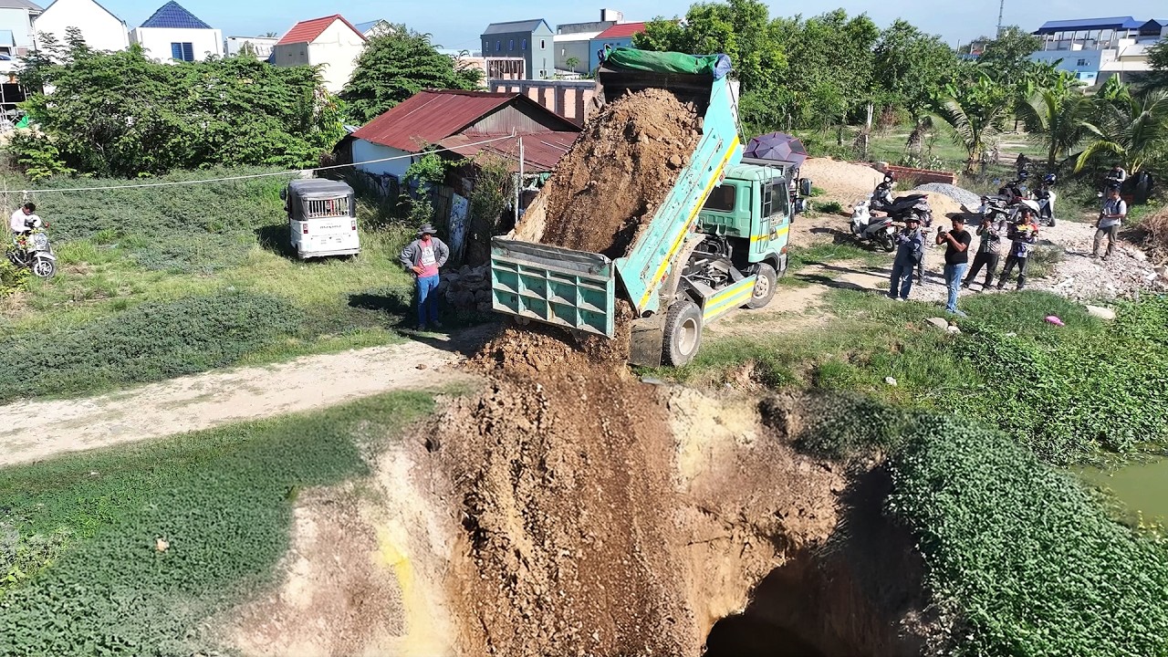 Full video of a project using a Komatsu D20p mini bulldozer to dig into a deep pond