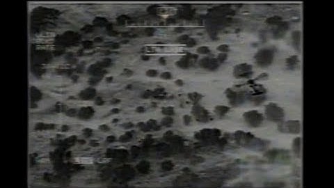 UAV Surveillance Drone Video of Helicopter Tracking Insurgents or Illegal Immigrants Crossing Border