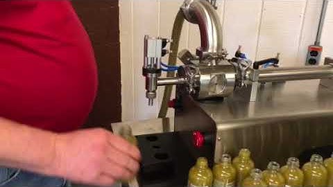 Apex Filling Systems -Tabletop Piston Filler Filling Hot Sauce