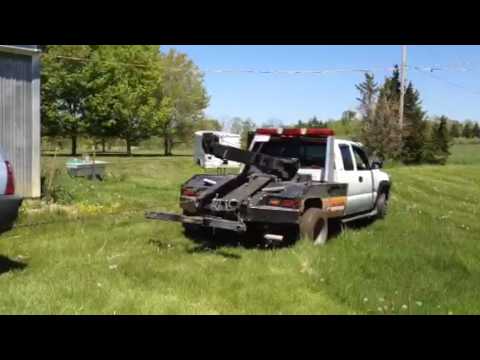 Toyota 4Runner pulling a tow truck through the mud - YouTube