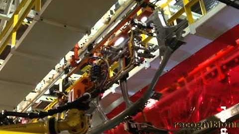 Recognition Robotics ~  Robotic Guidance - Body Panel Conveyor Pick