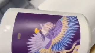 Nuocai small uv printer NC-UV0406 is printing the bottle.