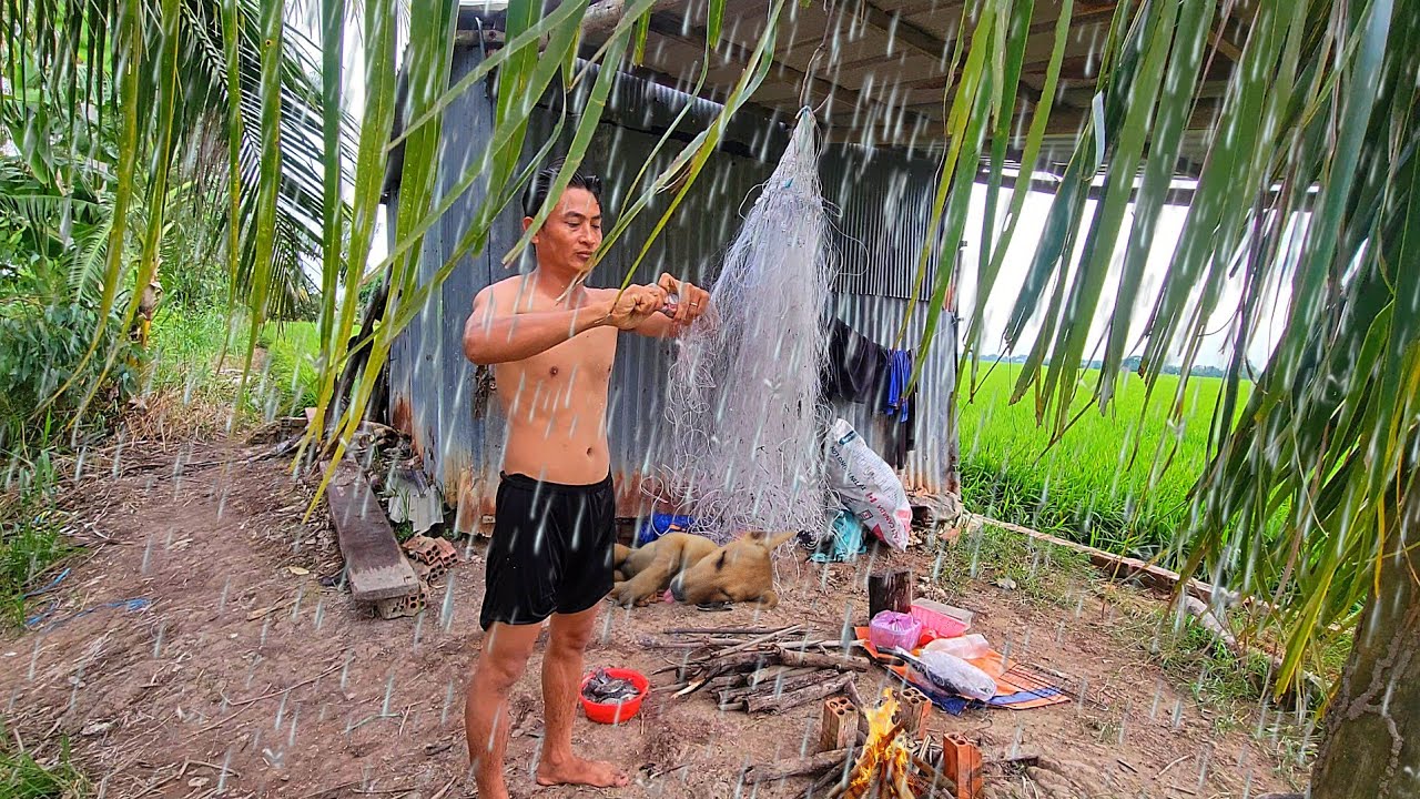 Heavy rain camping in wild camp, catching fish, cooking, sleeping overnight with a dog