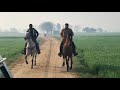 Ali bhai and mishal bhai riding country side with the long riders group s horses in punjab