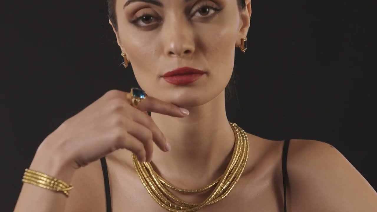 The Essence of Artistry: 24K Gold and Gemstone Elegance