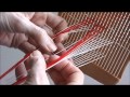 Weaving patterned bands with a double holed heddle.