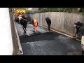 Long tarmac driveway being laid in Liverpool