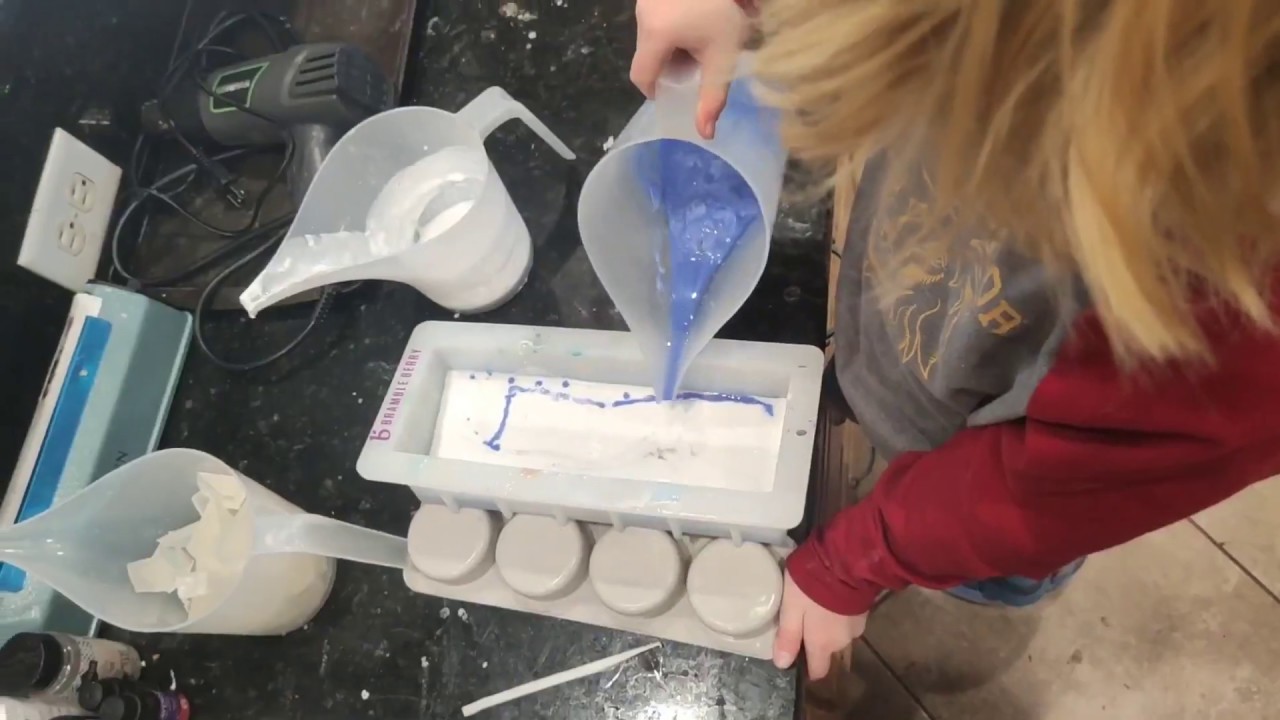 Hunter pouring melt & pour soap: moon embed loaf soap!