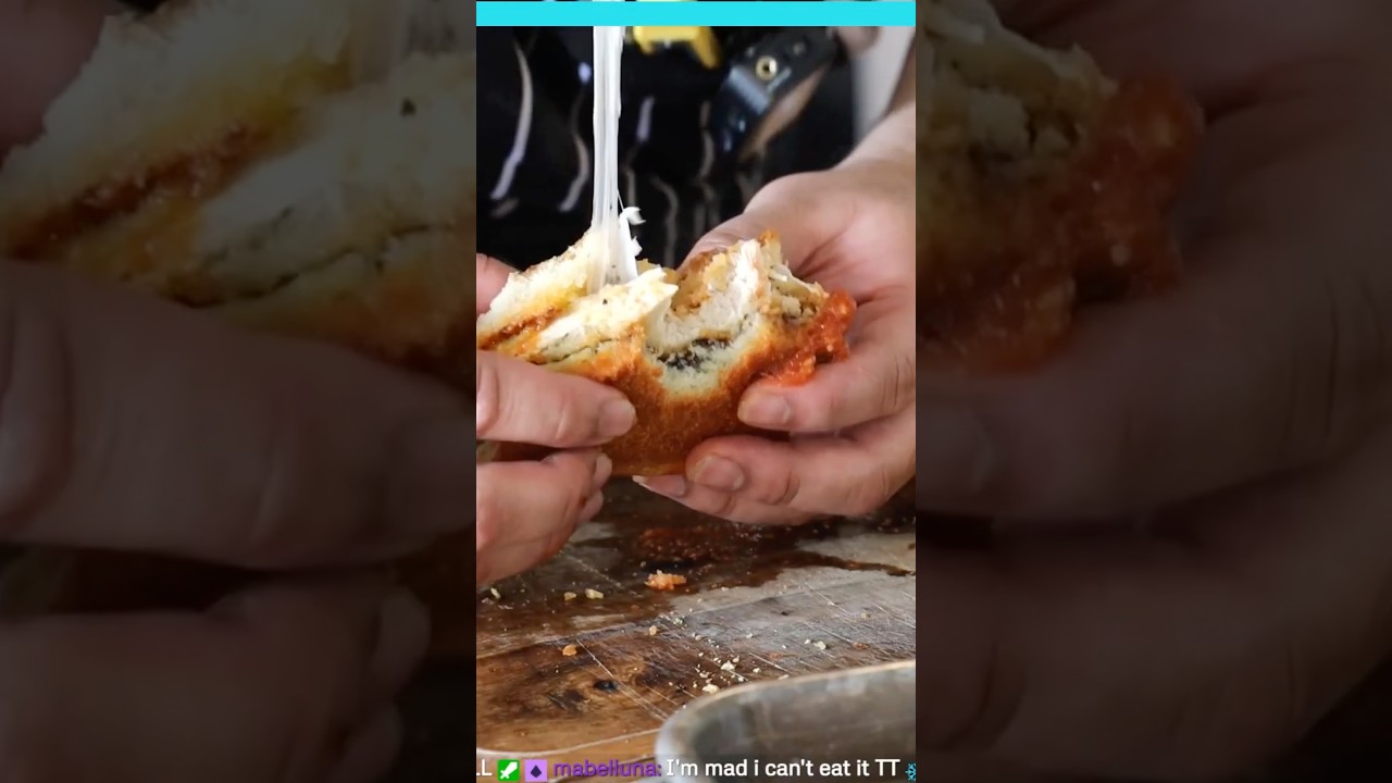 A nice big bite of the chicky parm sando feat. Cheez pull 