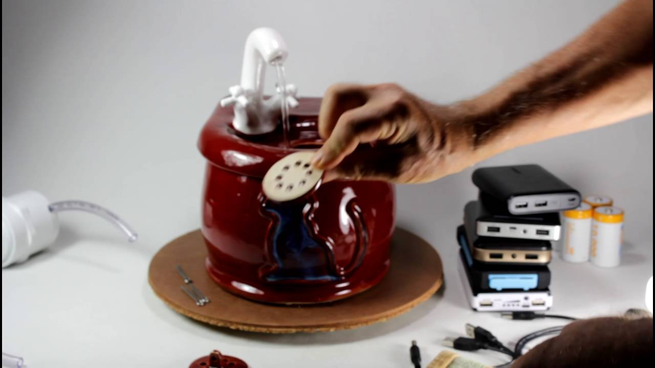 A cordless ceramic pet drinking fountain with internal battery