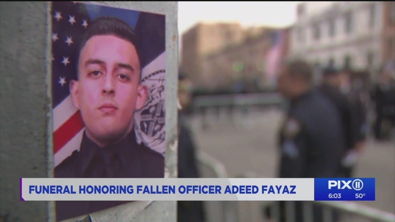 Funeral held for NYPD cop shot in off-duty robbery - YouTube