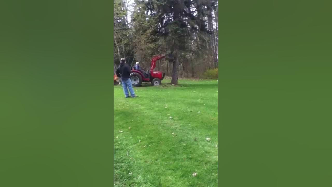 Tractor pushing tree over YouTube