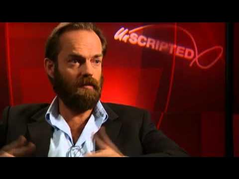 Hugo Weaving speaks to a TV reporter upon his arrival for the Tokyo premier  of his latest film V for Vendetta Monday, April 17, 2006. The political  action thriller, that stars Weaving