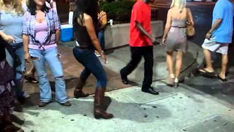 Vickie Wheeler dancingin front of Rippy's in Nashv...