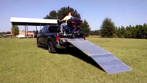Loading a Harley Davidson bagger in to the back of a pickup truck with a Loadall motorcycle ramp